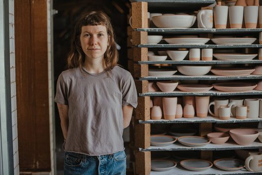 Cade Hollomon-Cook in front of the East Fork kiln.