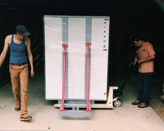 Alex and John unloading the Blaauw into a warehouse space.