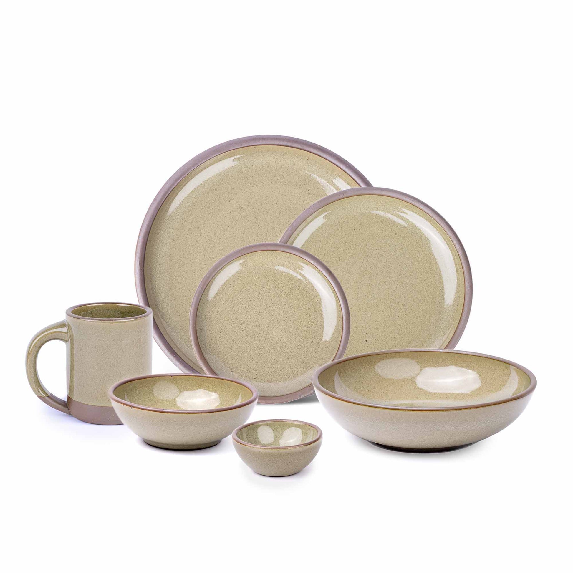 The Mug, bitty bowl, breakfast bowl, everyday bowl, cake plate, side plate and dinner plate in a reflective dappled grey-green color featuring unglazed rims