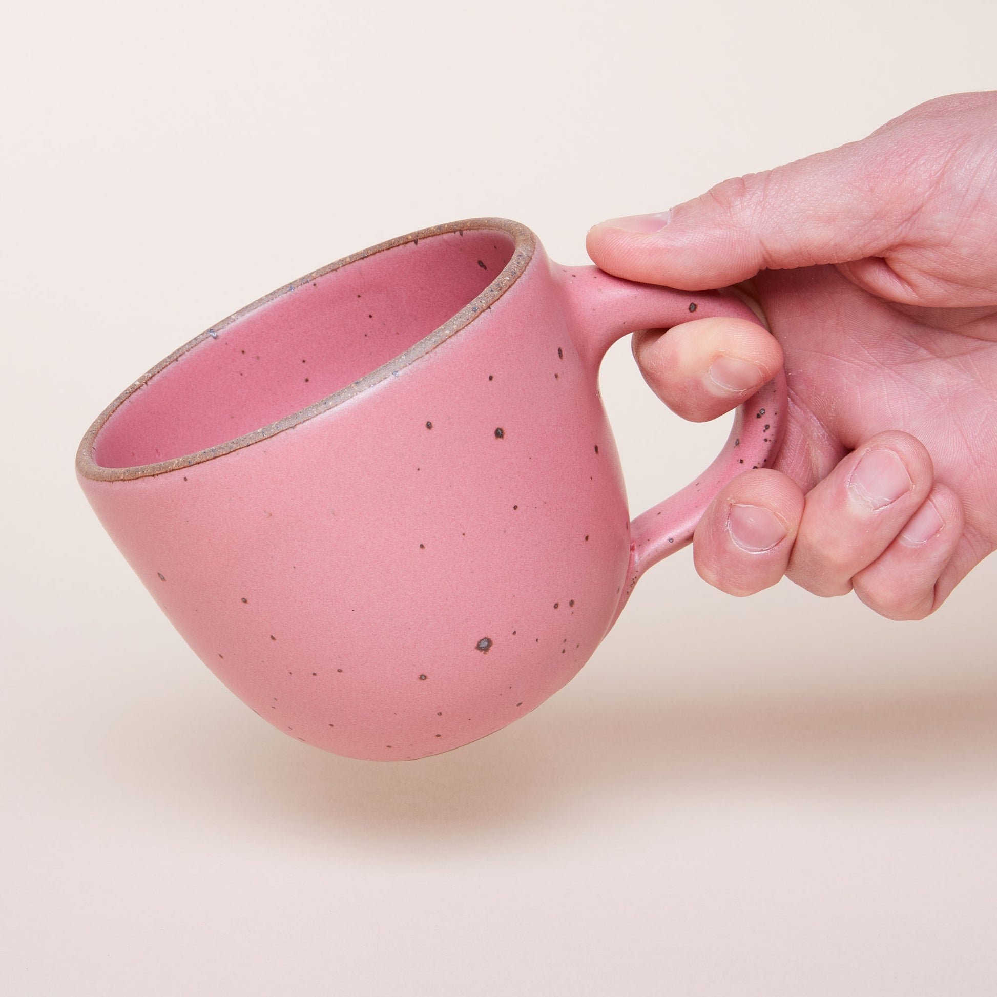 Hand holding a Sunday Morning Mug in Rococo