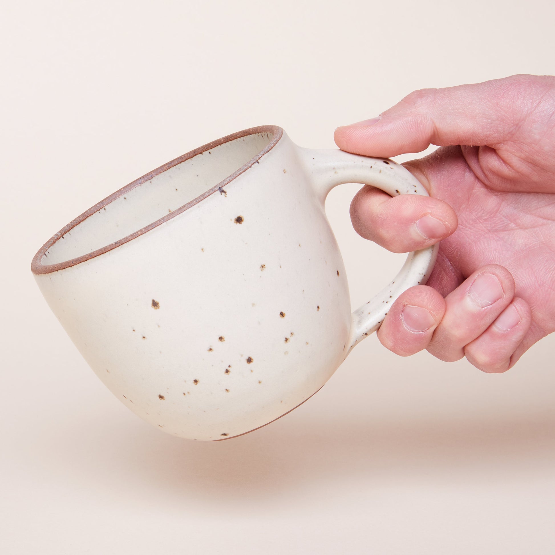 Hand holding Sunday Morning Mug in Panna Cotta
