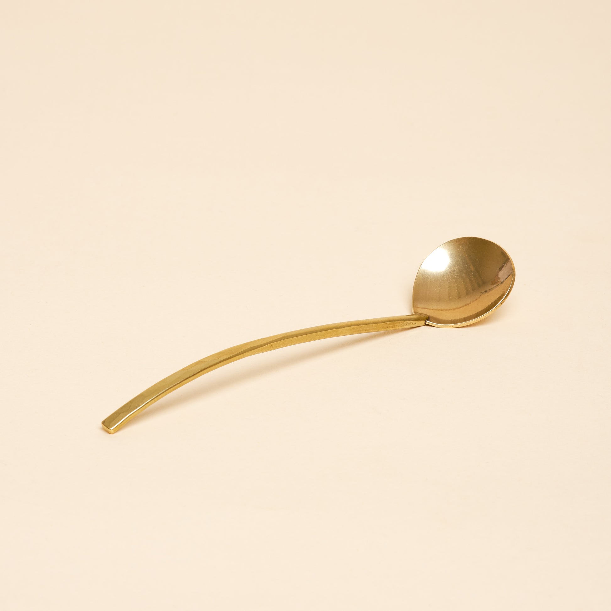 A miniature ladle designed for small scoops, from sugar to salt.